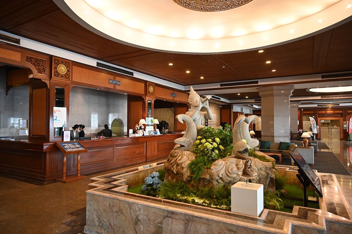 A hotel lobby with a reception desk