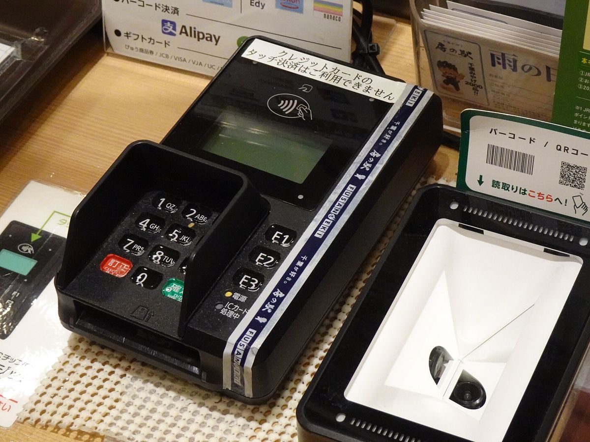 A card payment terminal on a shop counter